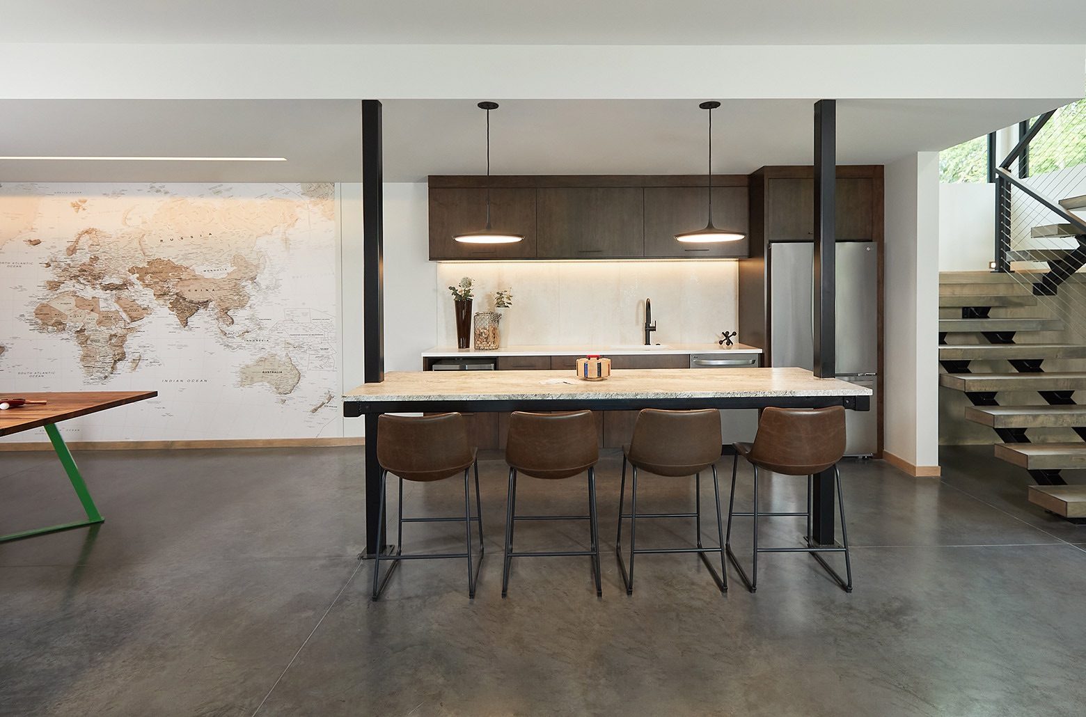 Basement recreation area with bar style seating and pingpong table