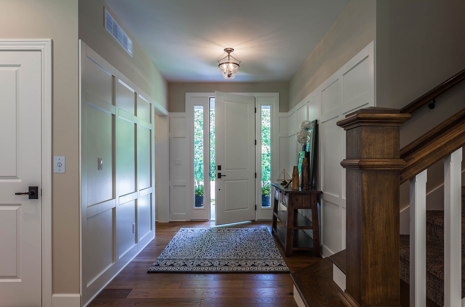 house entrance with white cabinets